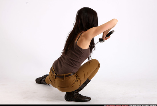 Woman Young Athletic Fighting with sword Kneeling poses Casual Asian