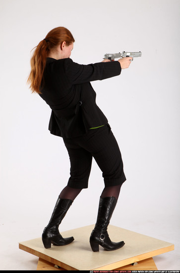 Woman Adult Average White Fighting with gun Standing poses Business