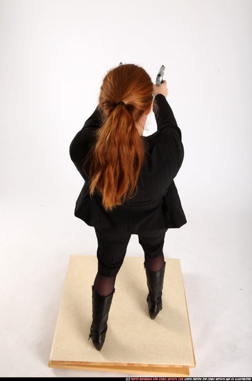 Woman Adult Average White Fighting with gun Standing poses Business