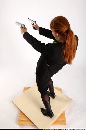 Woman Adult Average White Fighting with gun Standing poses Business