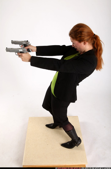 Woman Adult Average White Fighting with gun Standing poses Business