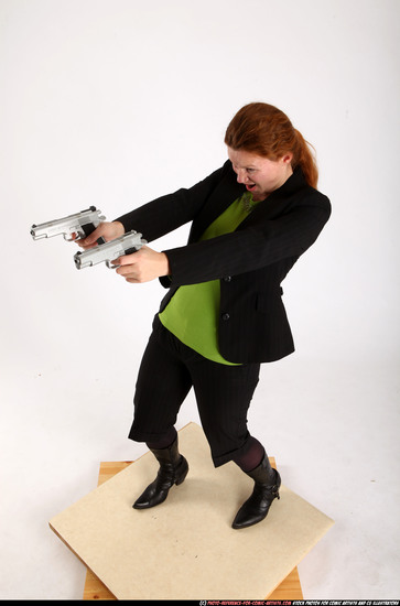 Woman Adult Average White Fighting with gun Standing poses Business