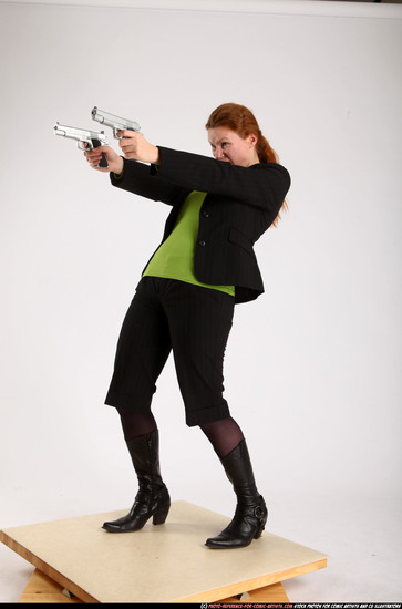 Woman Adult Average White Fighting with gun Standing poses Business