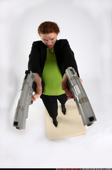 Woman Adult Average White Fighting with gun Standing poses Business