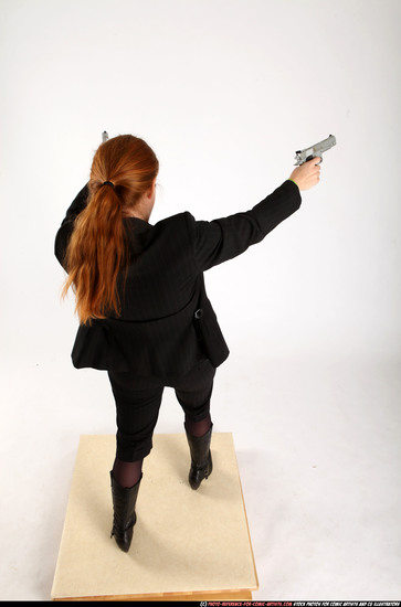 Woman Adult Average White Fighting with gun Standing poses Business