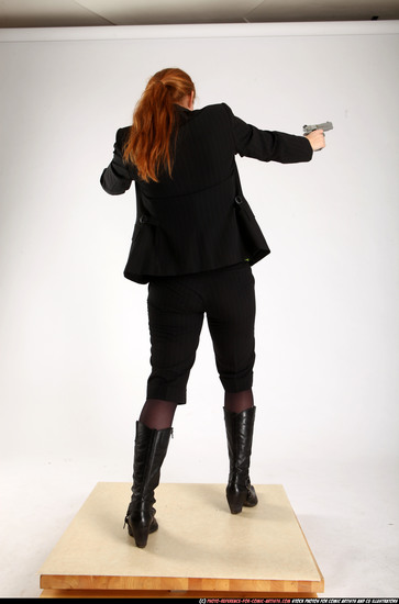 Woman Adult Average White Fighting with gun Standing poses Business