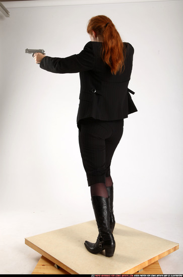 Woman Adult Average White Fighting with gun Standing poses Business