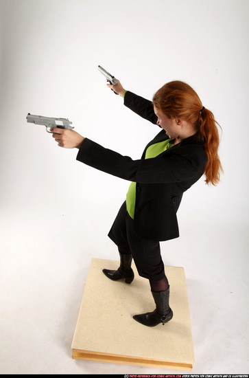 Woman Adult Average White Fighting with gun Standing poses Business