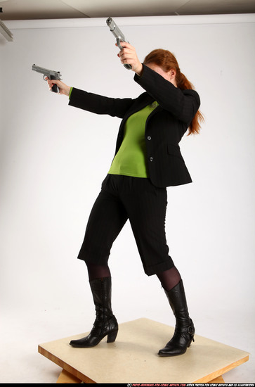 Woman Adult Average White Fighting with gun Standing poses Business