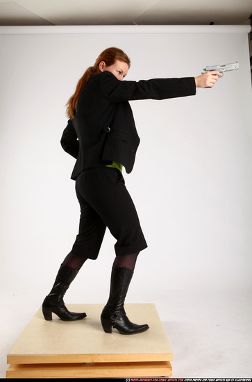 Woman Adult Average White Fighting with gun Standing poses Business