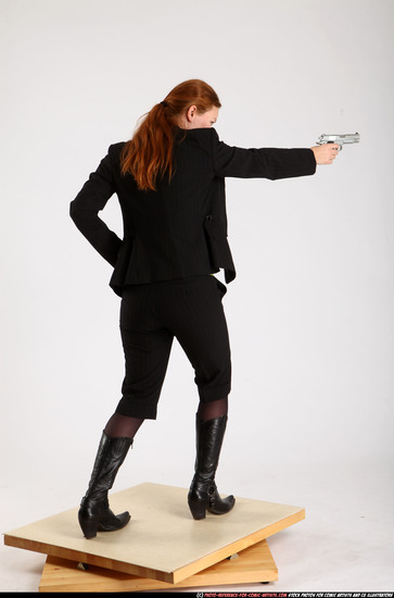 Woman Adult Average White Fighting with gun Standing poses Business