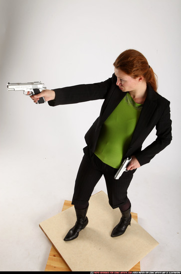 Woman Adult Average White Fighting with gun Standing poses Business