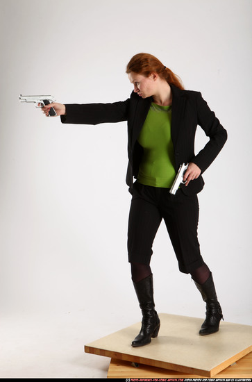 Woman Adult Average White Fighting with gun Standing poses Business