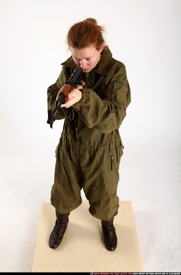 Woman Adult Average White Fighting with submachine gun Standing poses Army