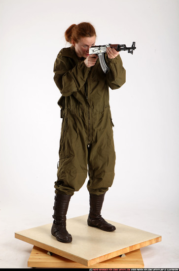 Woman Adult Average White Fighting with submachine gun Standing poses Army