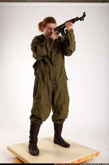 Woman Adult Average White Fighting with submachine gun Standing poses Army