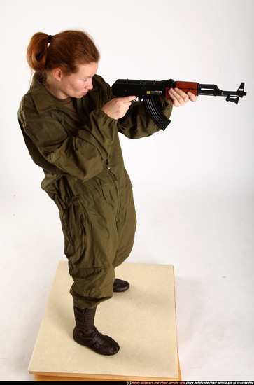 Woman Adult Average White Fighting with submachine gun Standing poses Army