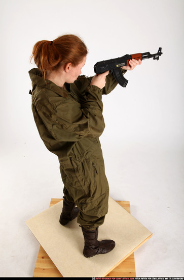 Woman Adult Average White Fighting with submachine gun Standing poses Army