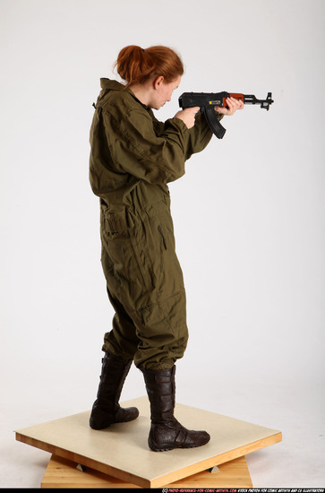 Woman Adult Average White Fighting with submachine gun Standing poses Army