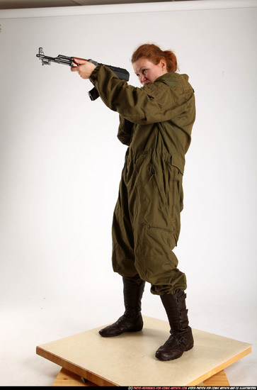 Woman Adult Average White Fighting with submachine gun Standing poses Army