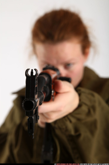 Woman Adult Average White Fighting with submachine gun Standing poses Army