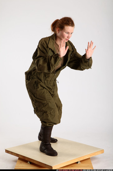 Woman Adult Average White Fist fight Standing poses Army