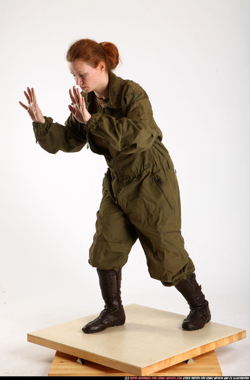 Woman Adult Average White Fist fight Standing poses Army