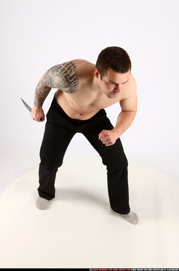 Man Adult Athletic White Fighting with knife Standing poses Pants