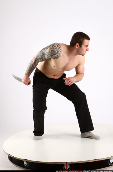 Man Adult Athletic White Fighting with knife Standing poses Pants