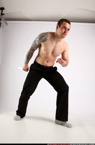 Man Adult Athletic White Fighting with knife Standing poses Pants