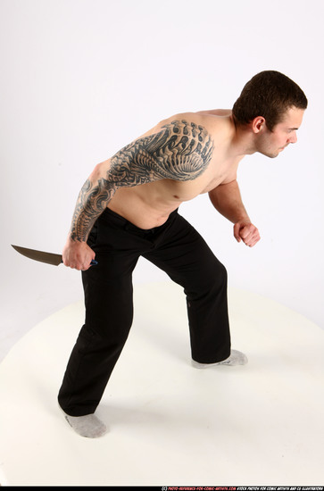 Man Adult Athletic White Fighting with knife Standing poses Pants