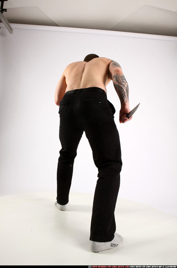 Man Adult Athletic White Fighting with knife Standing poses Pants