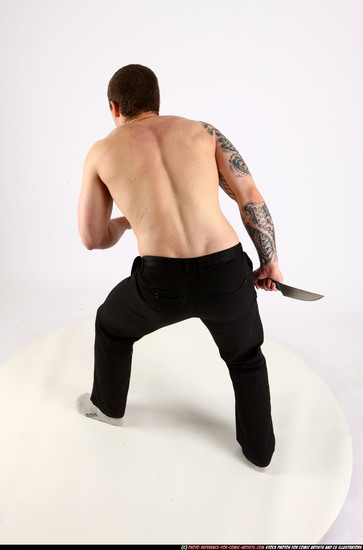 Man Adult Athletic White Fighting with knife Standing poses Pants