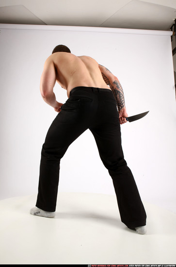 Man Adult Athletic White Fighting with knife Standing poses Pants