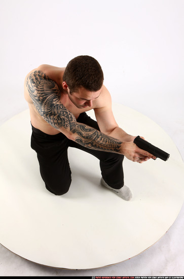 Man Adult Athletic White Fighting with gun Kneeling poses Pants