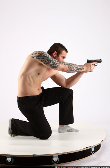 Man Adult Athletic White Fighting with gun Kneeling poses Pants