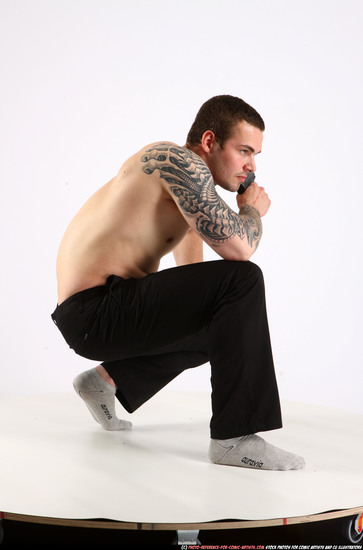 Man Adult Athletic White Fighting with gun Kneeling poses Pants