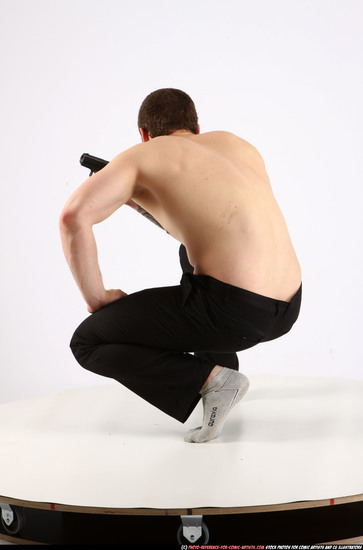 Man Adult Athletic White Fighting with gun Kneeling poses Pants