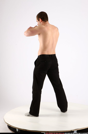 Man Adult Athletic White Fighting with knife Standing poses Pants