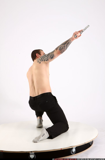 Man Adult Athletic White Fighting with gun Kneeling poses Pants