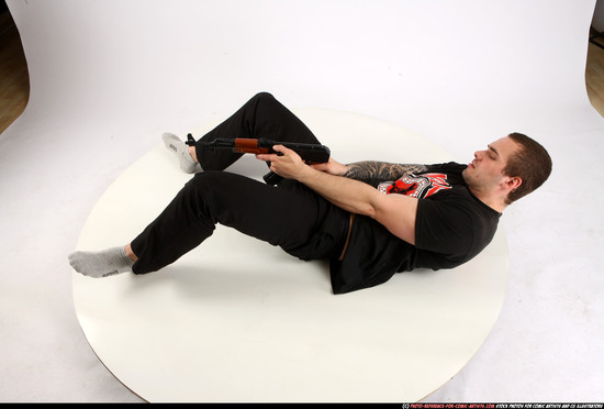 Man Adult Athletic White Fighting with submachine gun Laying poses Casual