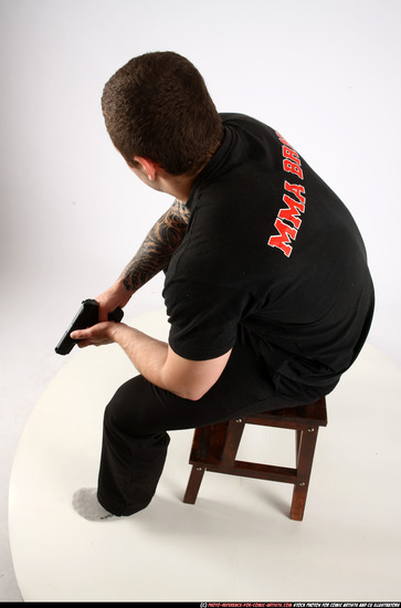 Man Adult Athletic White Fighting with gun Sitting poses Casual