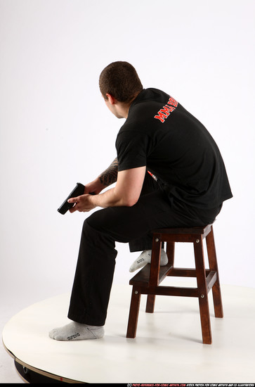 Man Adult Athletic White Fighting with gun Sitting poses Casual