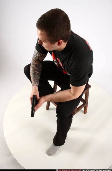 Man Adult Athletic White Fighting with gun Sitting poses Casual