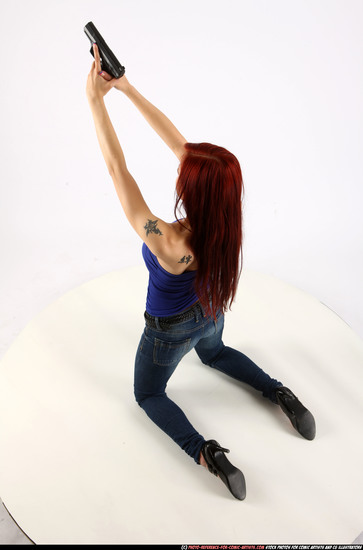 Woman Young Athletic White Fighting with gun Kneeling poses Casual