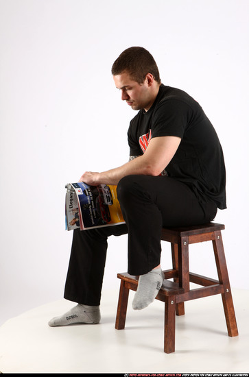 Man Adult Athletic White Fighting with gun Sitting poses Casual