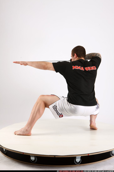 Man Adult Athletic White Fighting with sword Kneeling poses Sportswear