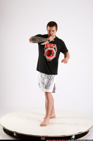 Man Adult Athletic White Fighting with knife Standing poses Sportswear