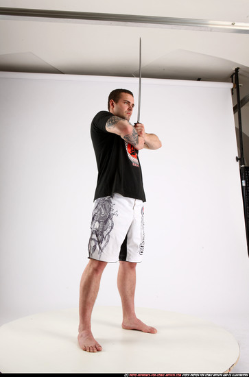 Man Adult Athletic White Fighting with sword Standing poses Sportswear