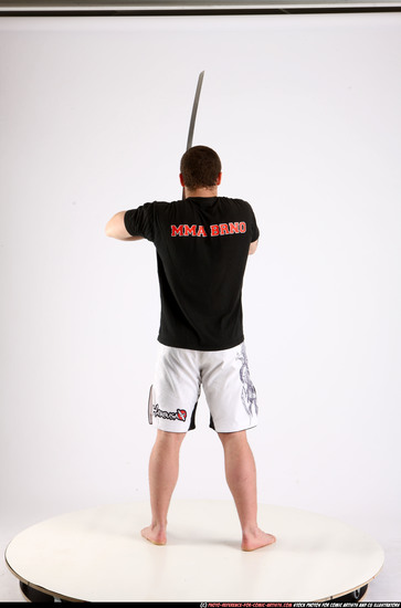 Man Adult Athletic White Fighting with sword Standing poses Sportswear